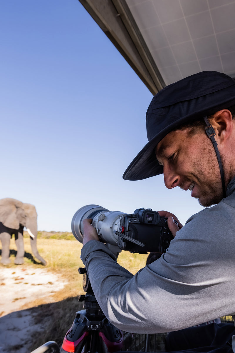 Tommy Joyce photographing in the field